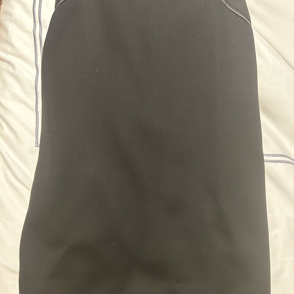 Eli Tahari  pencil skirt.  Part of the skirt is a scuba material.  Fully lined.